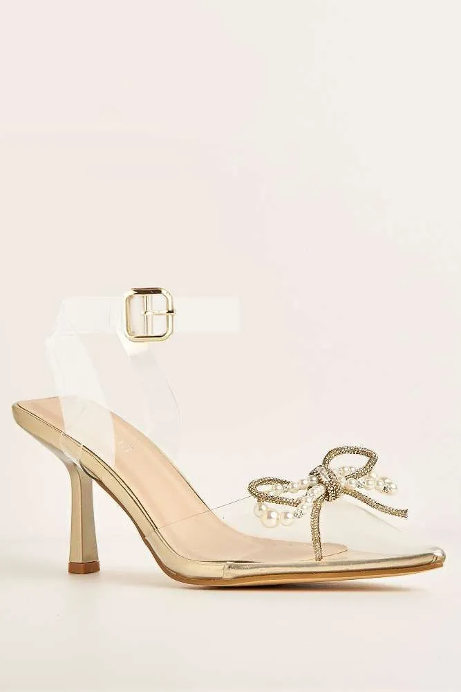 Orkide Diamante Bow and Pearl Detail Perspex Court Shoes in Gold